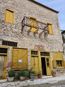 Old yellow mansion in Hydra, Greece