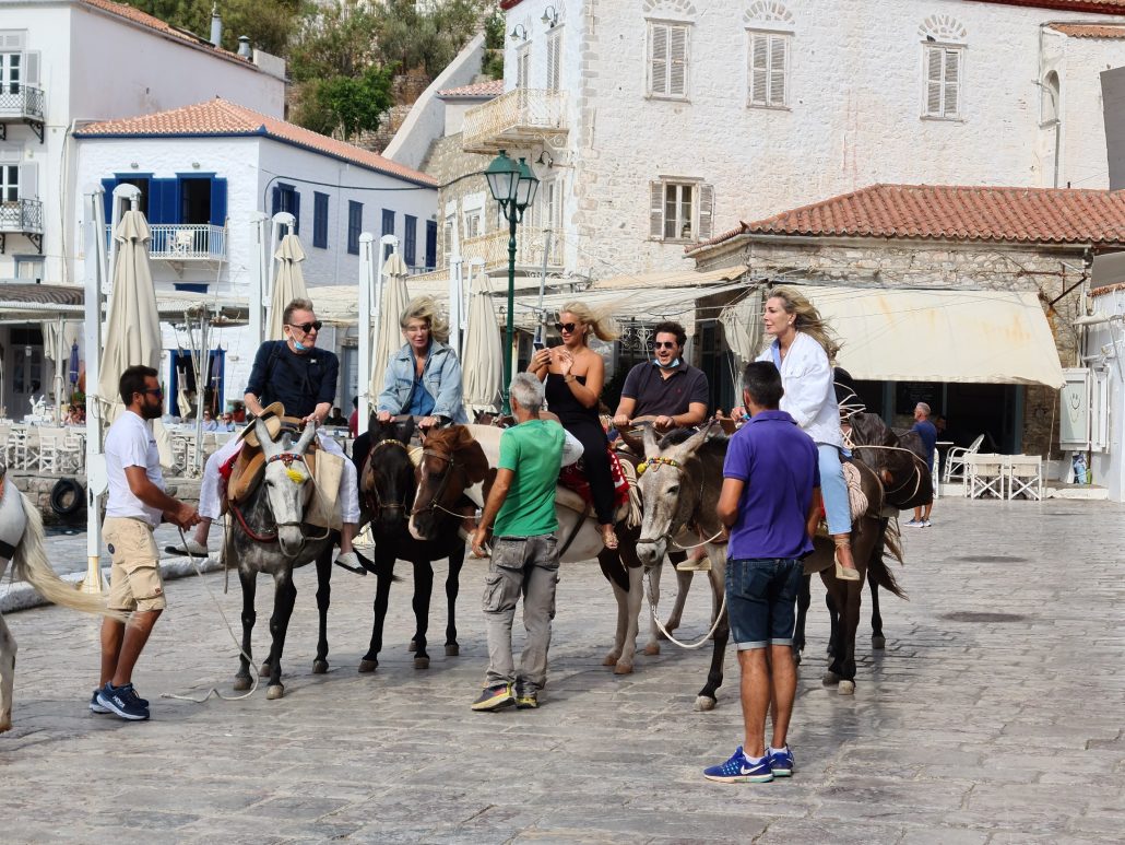 Tourists in Hydra get to their hotels on foot or by mule or donkey