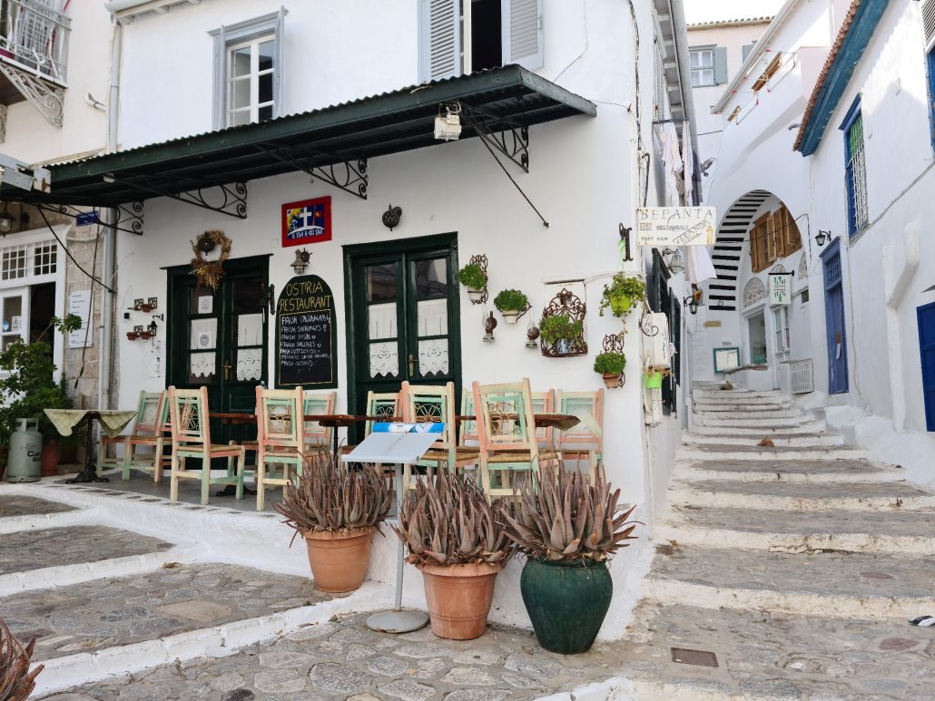 Café on a street corner in Hydra, Greece