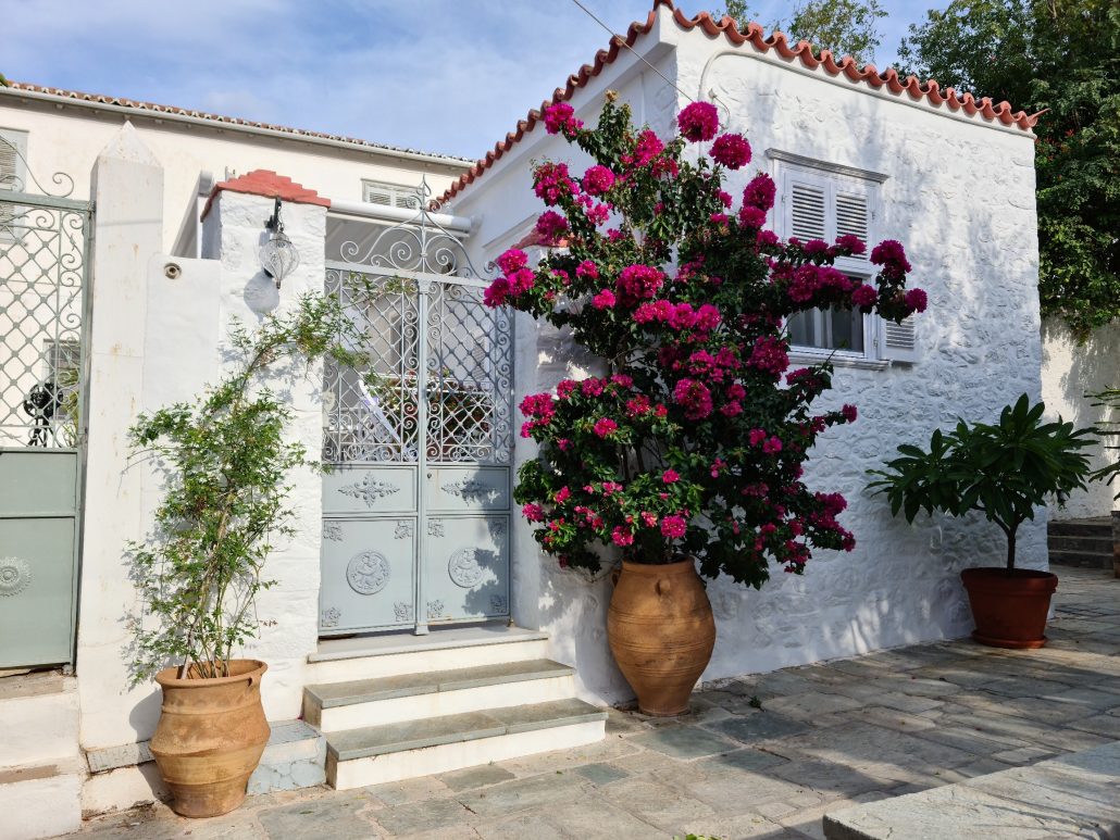 House on Hydra, Greece, with colourful bourganvillea outside