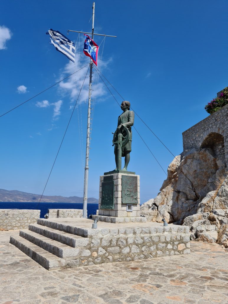 Statue of Andreas Miaoulis overlooking Hydra harbour