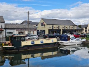 House boat reflected in the waters of the Grand Canal in Sallins Co Kildare