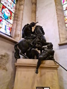 Statue of St Martin in the cathedral in Bratislava showing St Martin on a horse slicing his cloak in two to share with a beggar lying on the steet before him