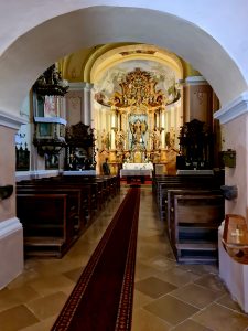 Church altar viewed through an archway