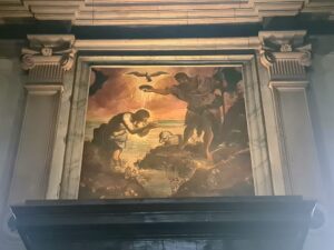 The Baptism of Christ by Tintoretto about a church door in Verona