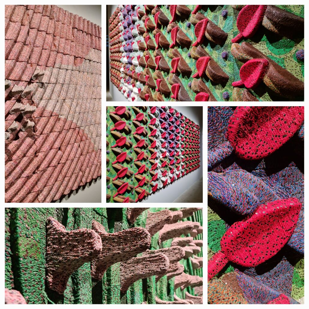 collage of six photos showing a large scale abstraction made from made from thousands of electrical wires, type keys, microchips, and computer hardware components. Left vertical picture is in pinks. The others are a mix of reds and purples and greens in 3D. If laid flat on the ground it would look like a flower bed but it's hanging on a wall