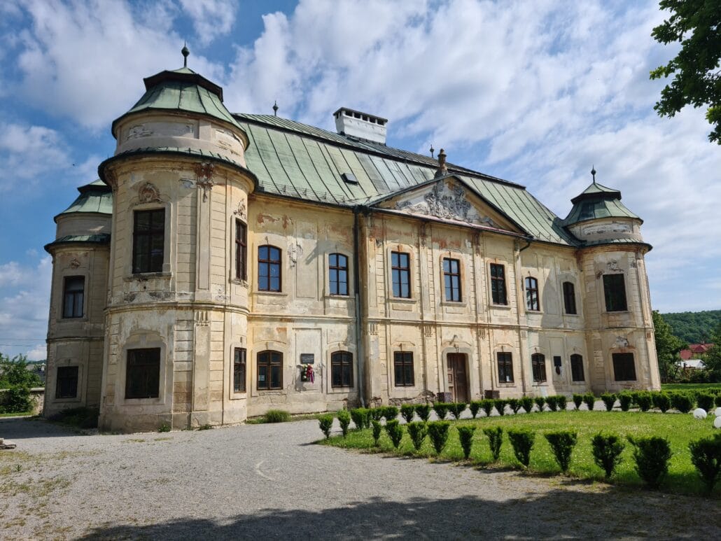 Baroque mansion with green copper roofd and turrets on each corner