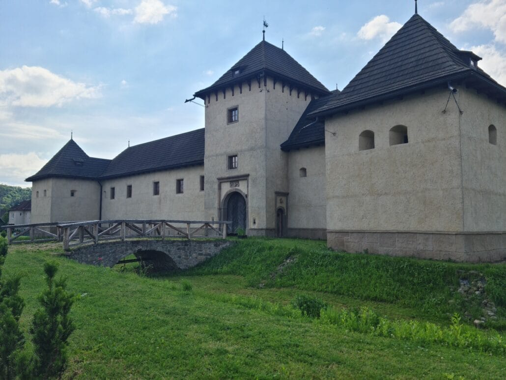 Old 15th-century castle with bridge crossing a dry moat
