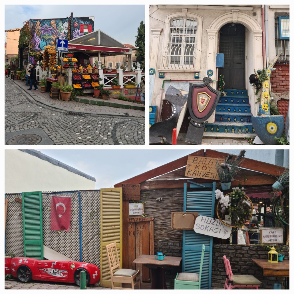 Fruit stand up against a white fence of a building with a very colourful mural; painted blue steps leading up to a white building; colourful cafe with some pink and yellow and green doors hanging from a fence