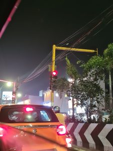 Red traffic light showing a red heart rather than a circle