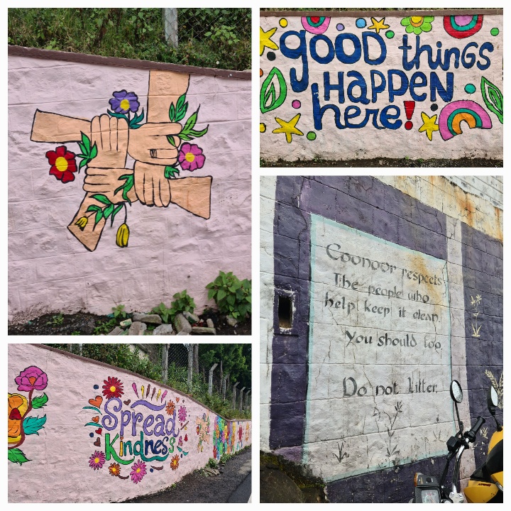Murals 1 showing four hands clasped, writing showing GOOD THINGS HAPPEN HERE and SPREAD KINDNESS and a separate one that says Coonoor respects the people who help keep it clearn,. You should too. Do not litter.