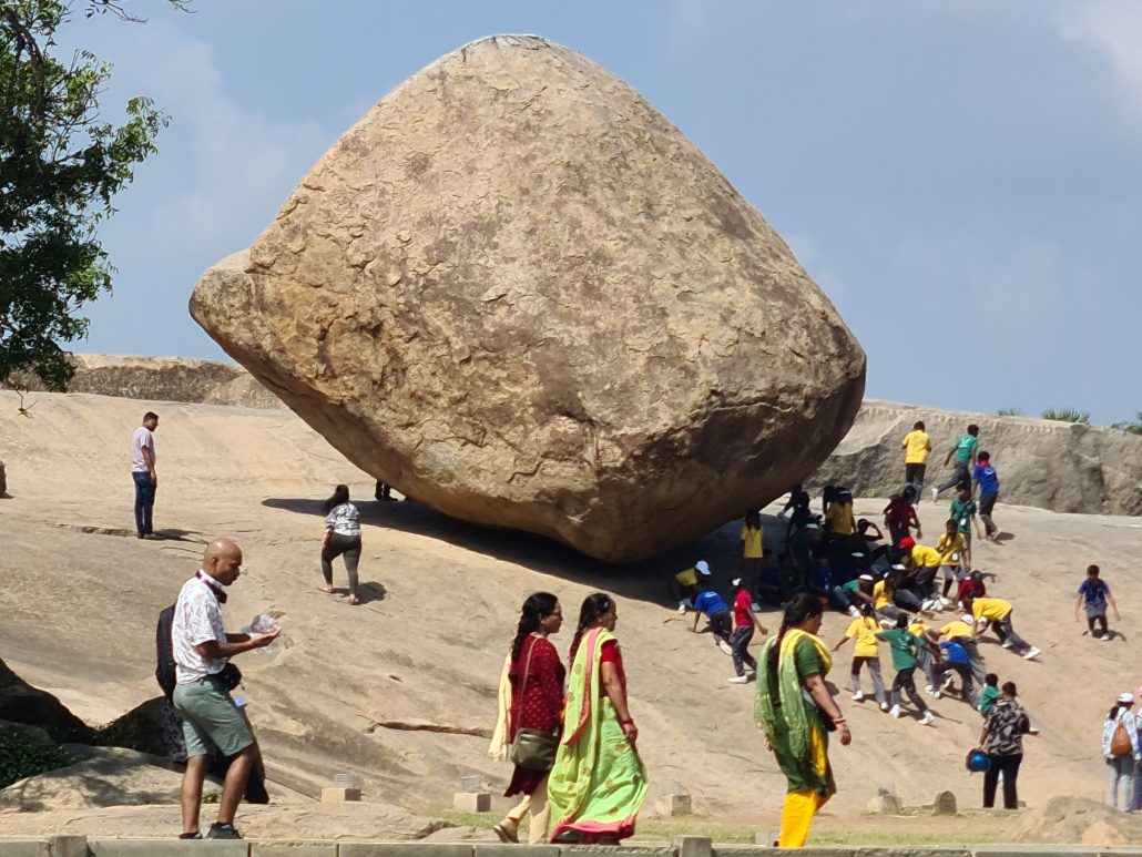 The boulder is approximately six metres (20 ft) high and five metres (16 ft) wide and weighs around 250 tonnes (250 long tons; 280 short tons).[14] It seems to float and barely stand on a slope on top of a 1.2-meter (4 ft) high plinth which is a naturally eroded hill. The rock is estimated to be 1,200 years old