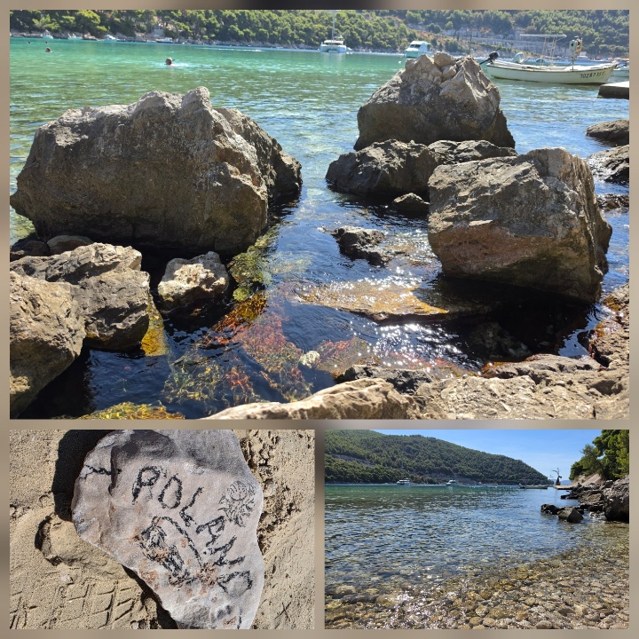 “Rocky shoreline beside clear blue-green Adriatic water, with boats anchored offshore and a wooded hillside across the bay; smaller images show marked rocks and the transparent shallows.”